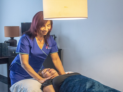 Picture of a guest receiving care at the Costa Rica Medical Center Inn, San Jose, Costa Rica.  The guest is lying down on a treatment couch.